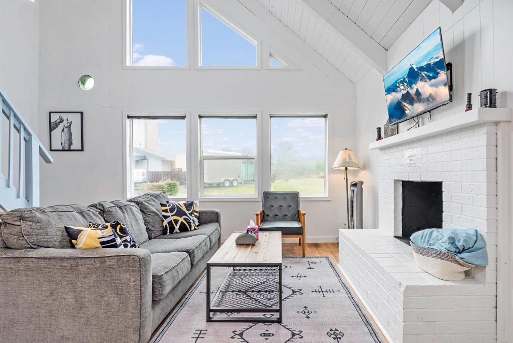 a living room with a couch and a fireplace at Tidal House 2 in Ocean Shores