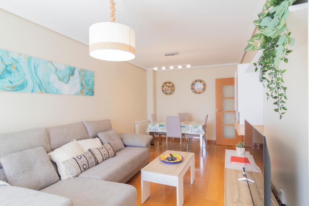 a living room with a couch and a table at APARTAMENTO Holidea OLMECA in Santander