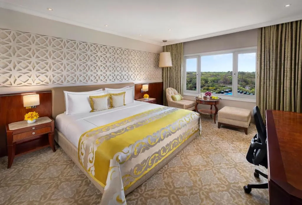 Deluxe Room King Bed Forest and Pool View
