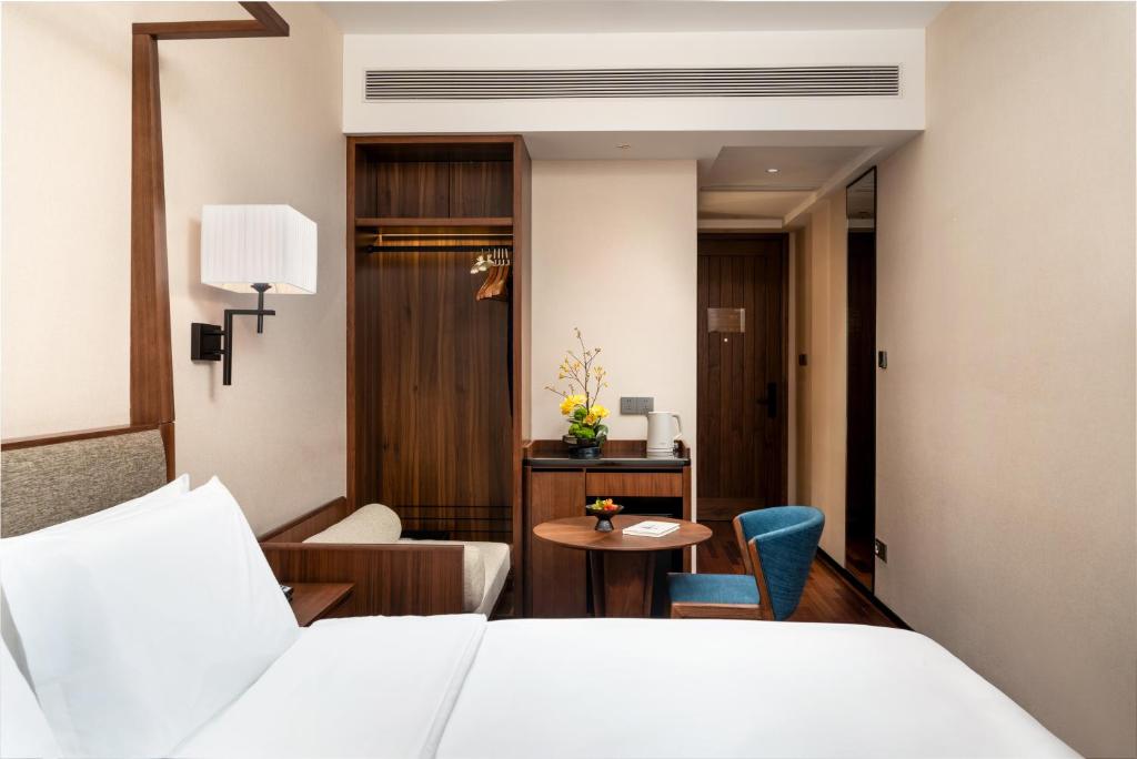 Postel nebo postele na pokoji v ubytování SSAW Boutique Hotel Foshan Qiandeng Lake