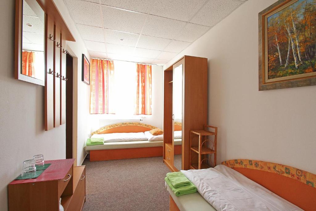 Postel nebo postele na pokoji v ubytování Apartmány HABURA