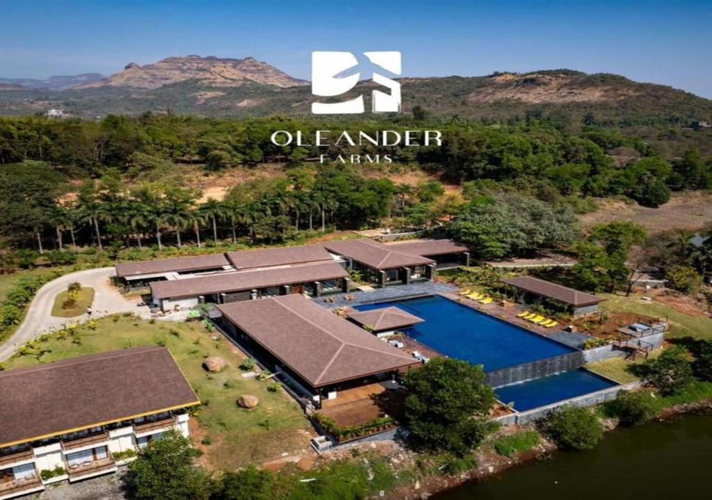 an aerial view of an estate with a swimming pool at Oleander Farms, Karjat in Karjat