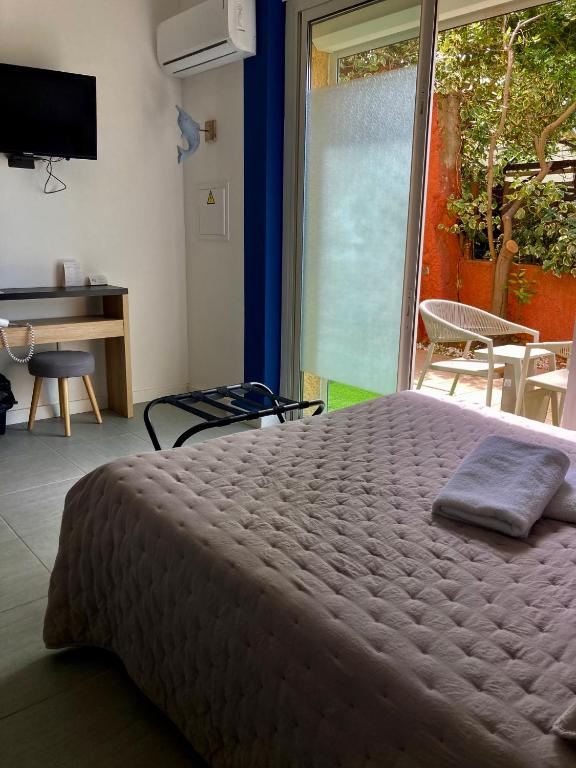 Postel nebo postele na pokoji v ubytování Hôtel Le Gambetta