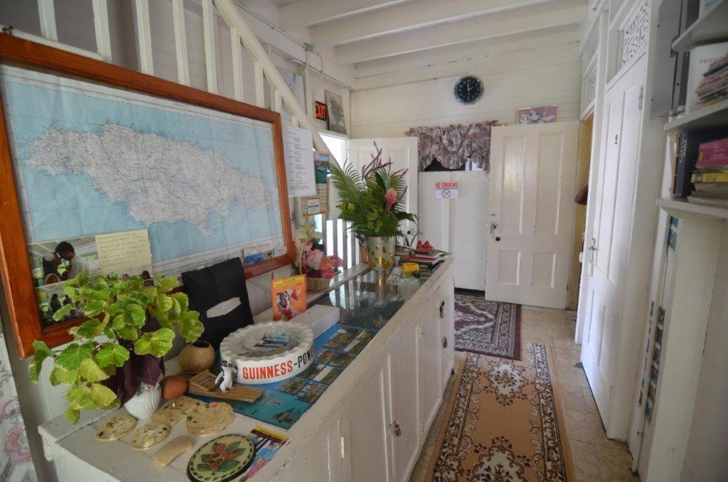 a kitchen with a counter with a map on the wall at Holiday Home - Guest House in Port Antonio