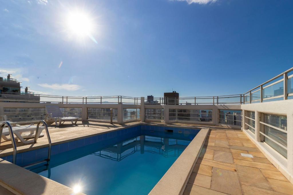 a swimming pool on the roof of a building at Rio Branco Hotel in Florianópolis