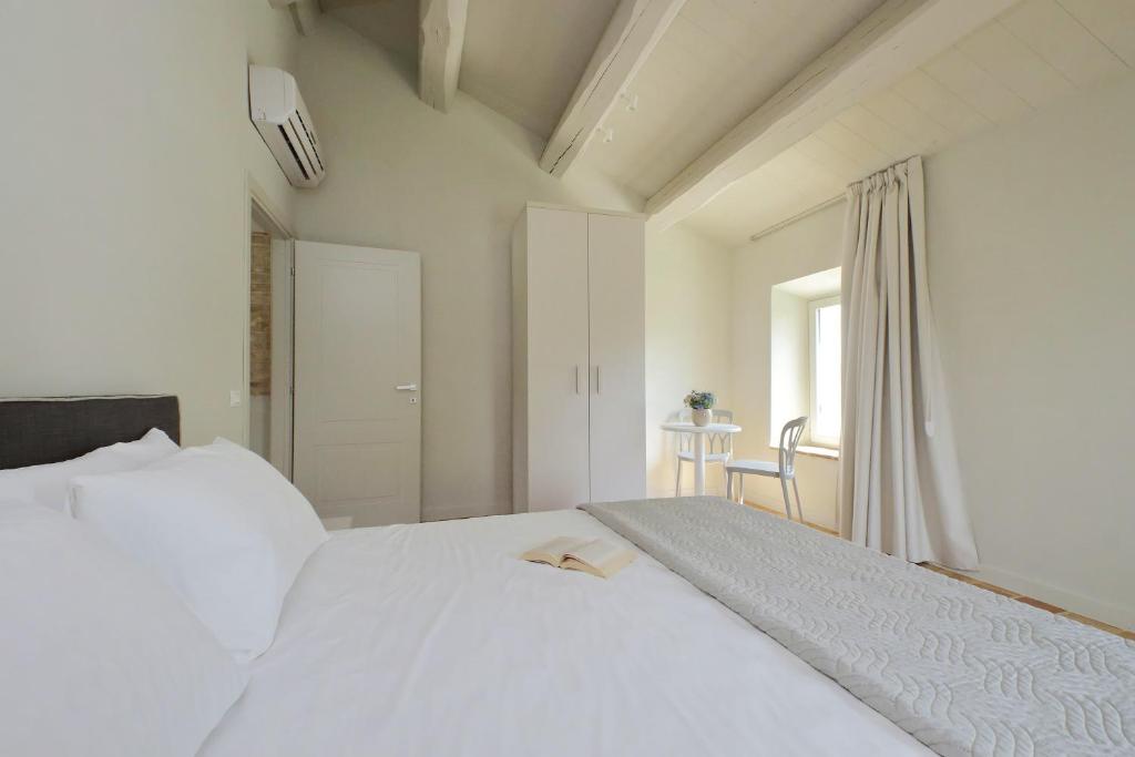 Postel nebo postele na pokoji v ubytování Agriturismo Biancarda