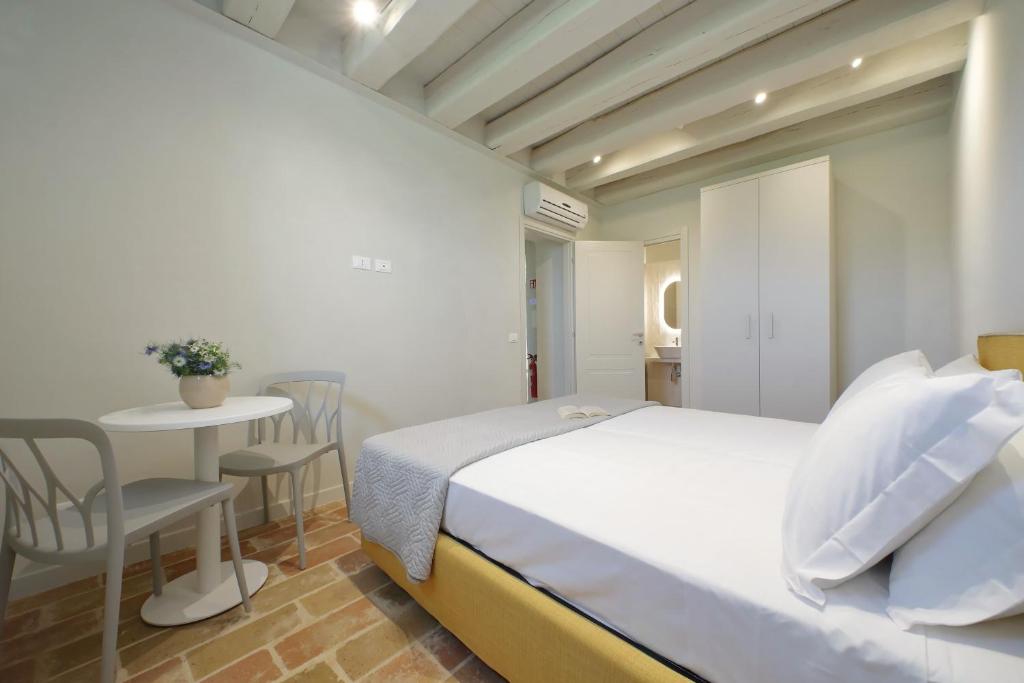 Postel nebo postele na pokoji v ubytování Agriturismo Biancarda