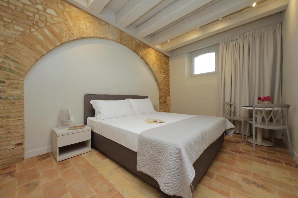 Postel nebo postele na pokoji v ubytování Agriturismo Biancarda