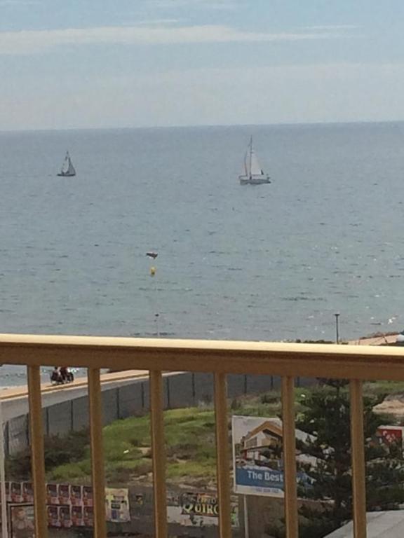 a view of the ocean with boats in the water at Apartamento Cala Del Palangre in Torrevieja