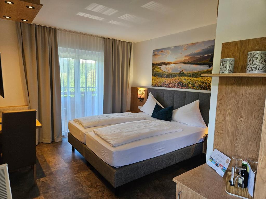 Postel nebo postele na pokoji v ubytování Dei Hotel Schönblick