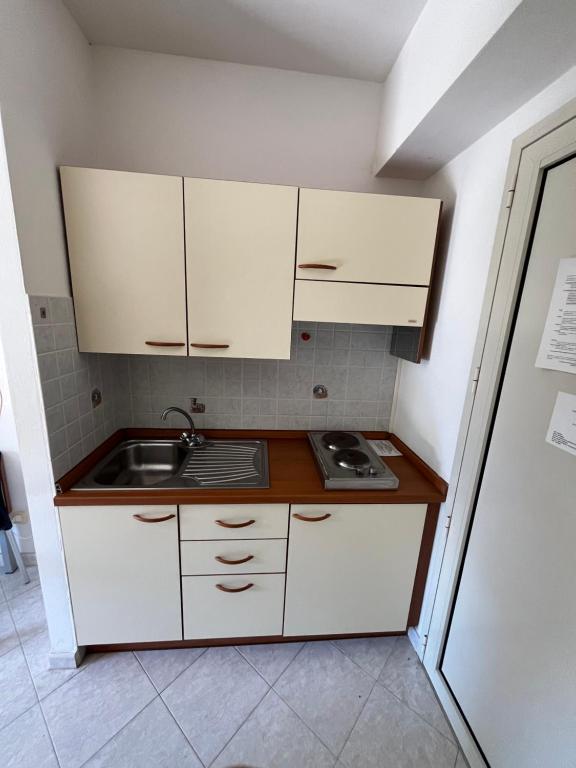 Kuchyň nebo kuchyňský kout v ubytování Residence Verde Pineta