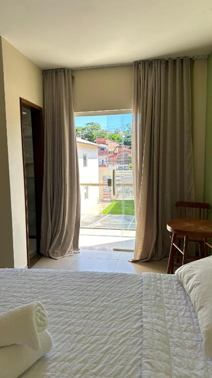 Cama ou camas em um quarto em Humaita Pousada