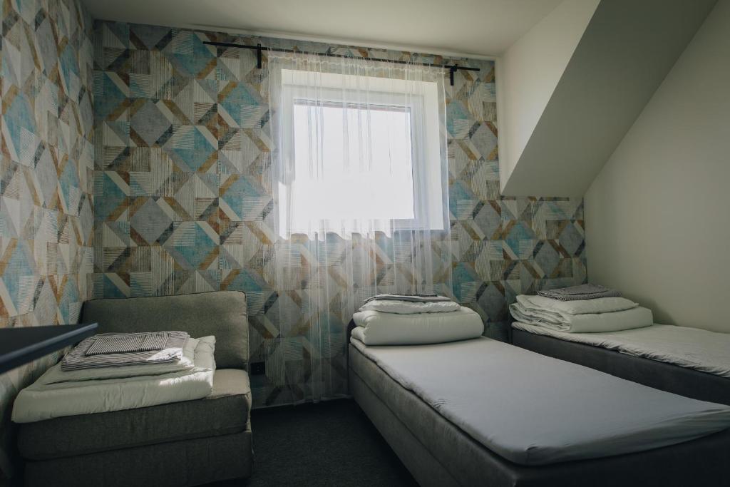 Posteľ alebo postele v izbe v ubytovaní Apartamenty Leśna