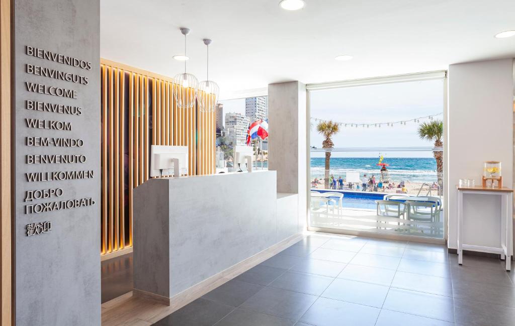 a restaurant with a view of the ocean at Hotel Brisa in Benidorm