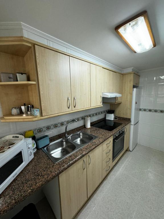 Kuchyň nebo kuchyňský kout v ubytování Apartamento caribe