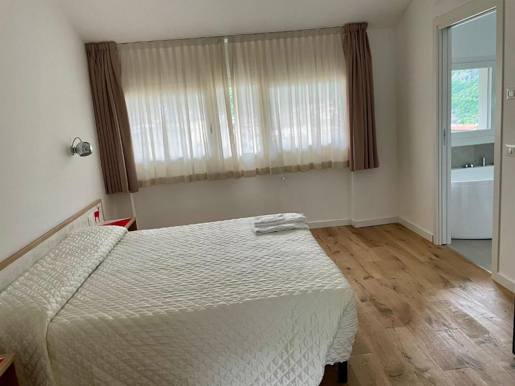 Postel nebo postele na pokoji v ubytování Hotel Giardino