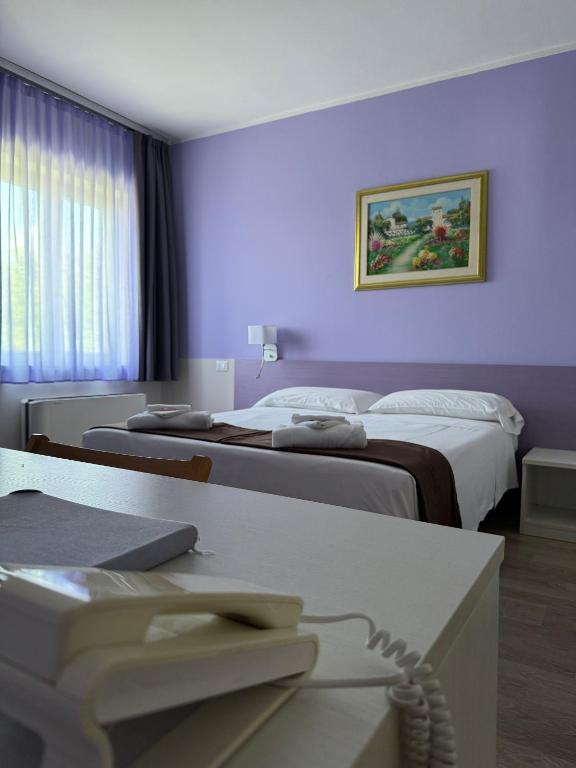 Postel nebo postele na pokoji v ubytování Albergo Trattoria Italia