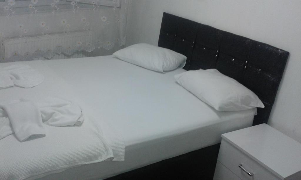 Postel nebo postele na pokoji v ubytování Bereket traveler Hotel