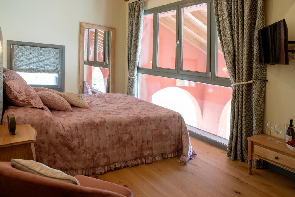 Postel nebo postele na pokoji v ubytování Agriturismo La Rosarnetta