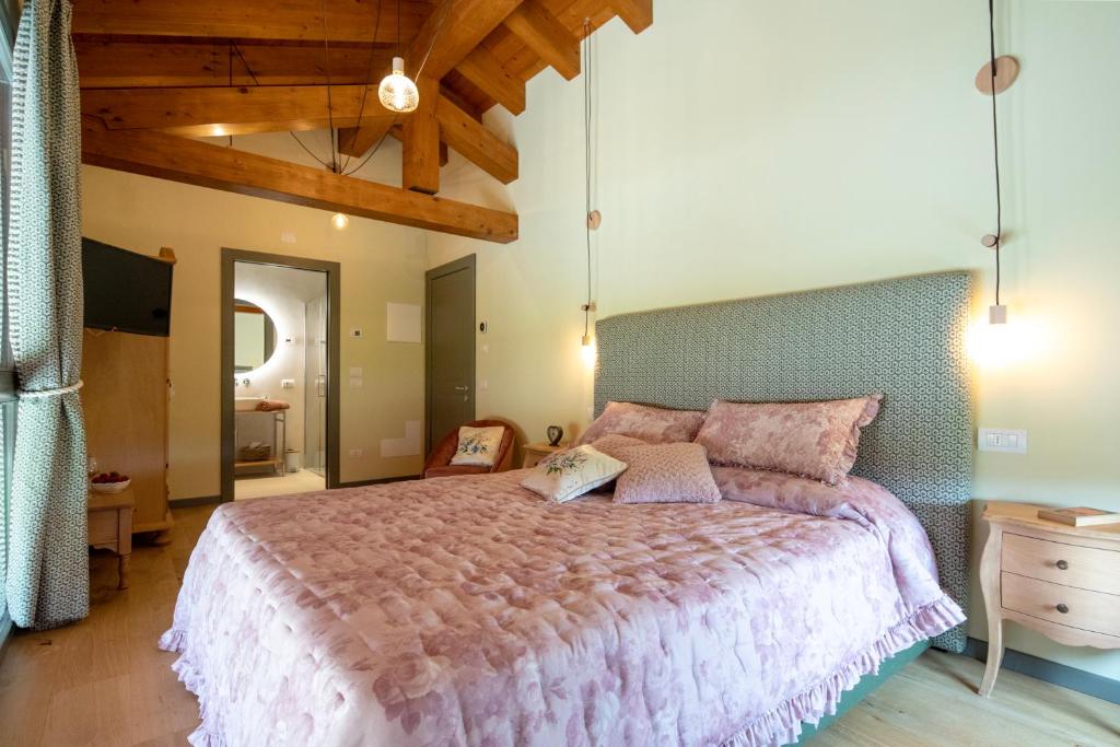 Postel nebo postele na pokoji v ubytování Agriturismo La Rosarnetta