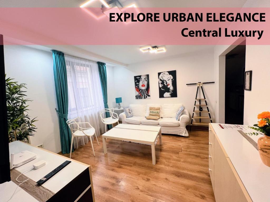 a living room with a couch and a table at Royal Grand Suite in Cluj-Napoca