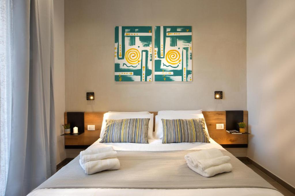 Postel nebo postele na pokoji v ubytování MARE FUORI ROOMS