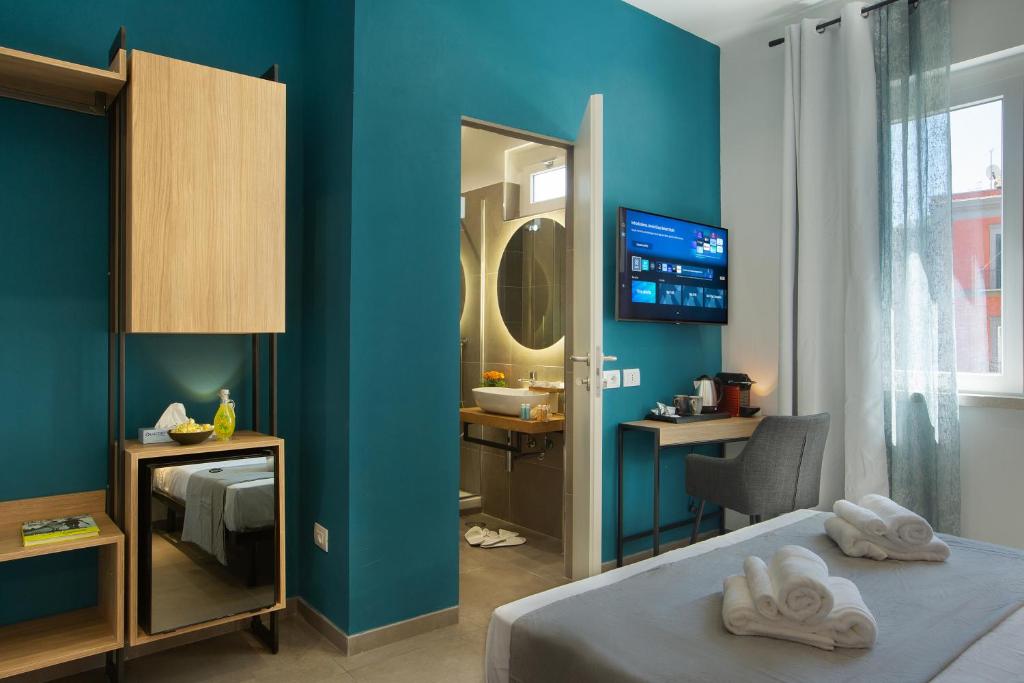 Postel nebo postele na pokoji v ubytování MARE FUORI ROOMS