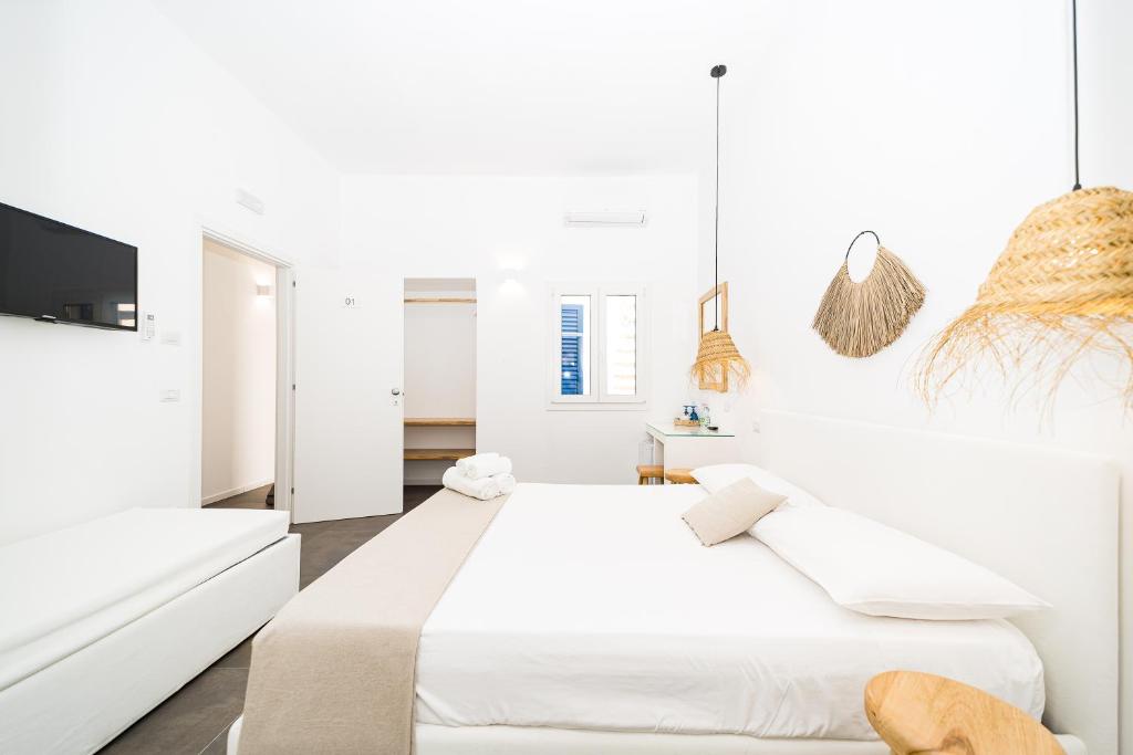 Postel nebo postele na pokoji v ubytování Salento Boutique Suite