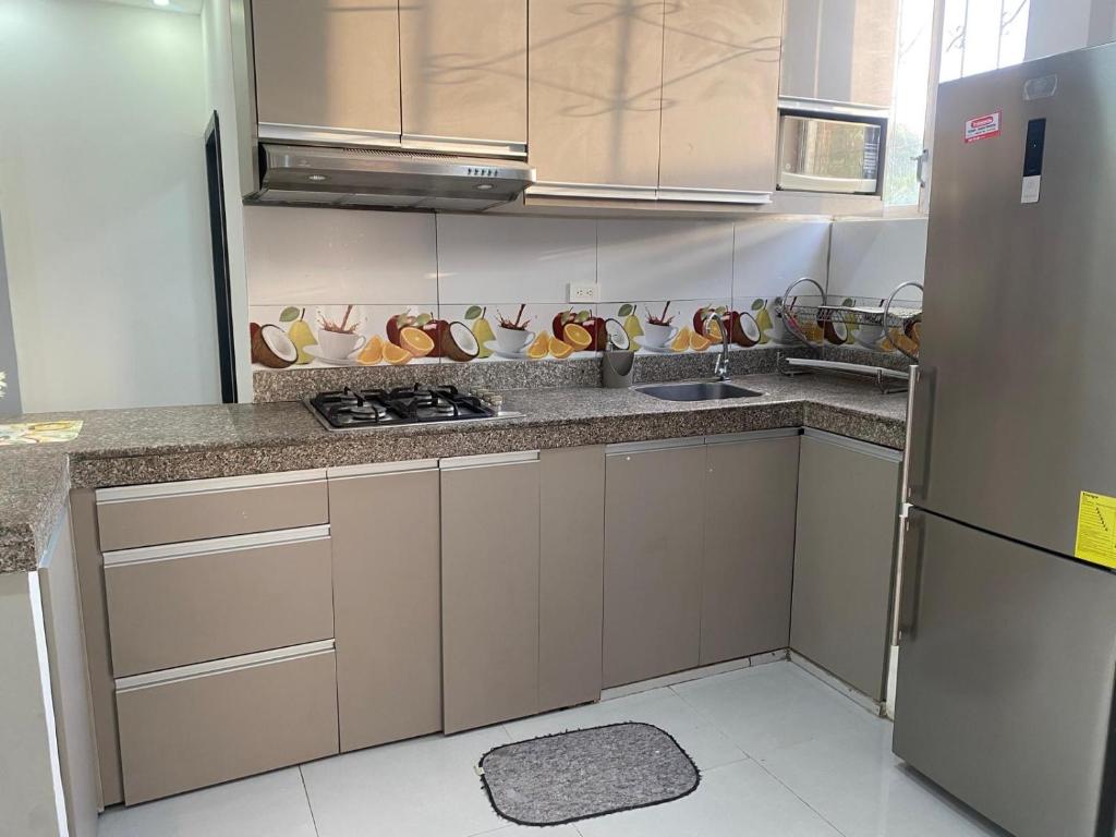 Kuchyň nebo kuchyňský kout v ubytování Pacific Stone Apartamento