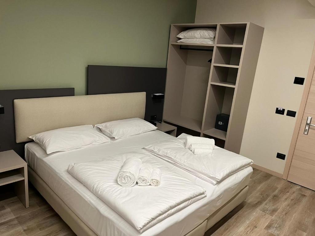Postel nebo postele na pokoji v ubytování Ile Hotel
