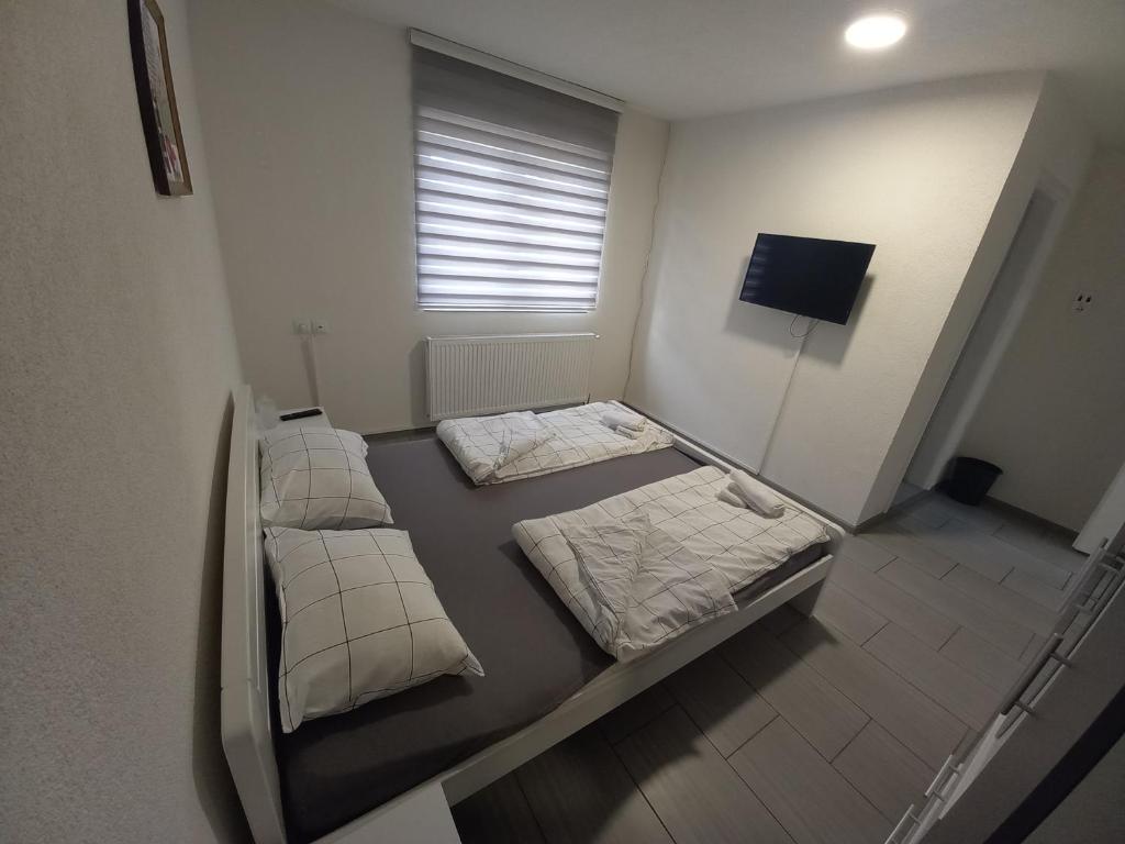 Postel nebo postele na pokoji v ubytování SOBE CICKO