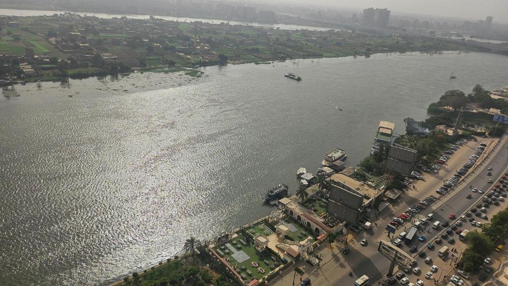 an aerial view of a river with a city at Grand Bayan Hotel & Apt at Nile Plaza in Cairo