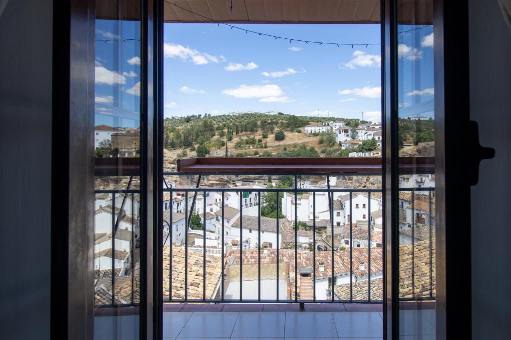 a view of a city from a window at La Casa de la Lela in Setenil