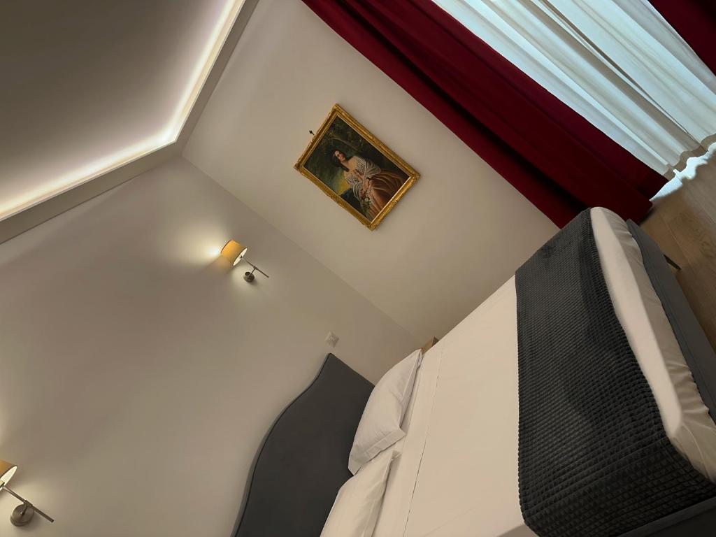 A bed or beds in a room at GUALTIERI B&b - LUXURY ROOMS