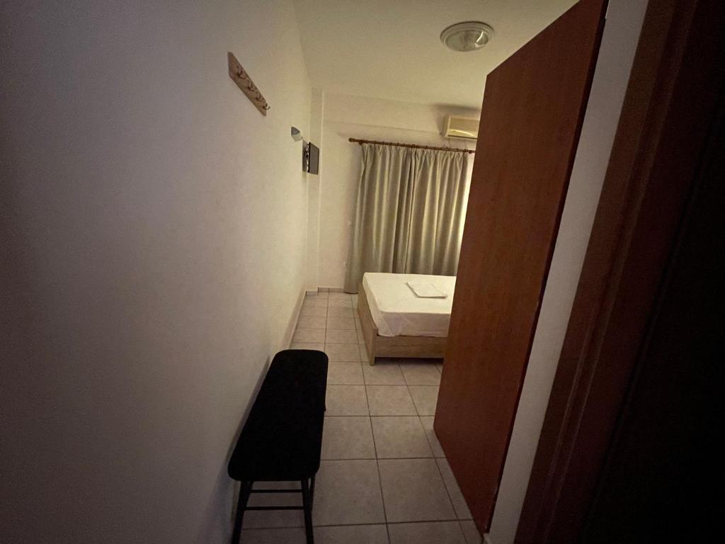 Postel nebo postele na pokoji v ubytování Hotel Evagelia