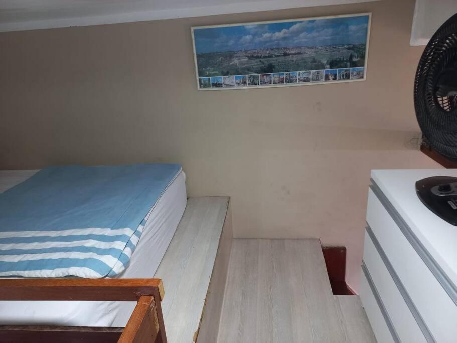 Ein Bett oder Betten in einem Zimmer der Unterkunft Loft Maior Aconchegante