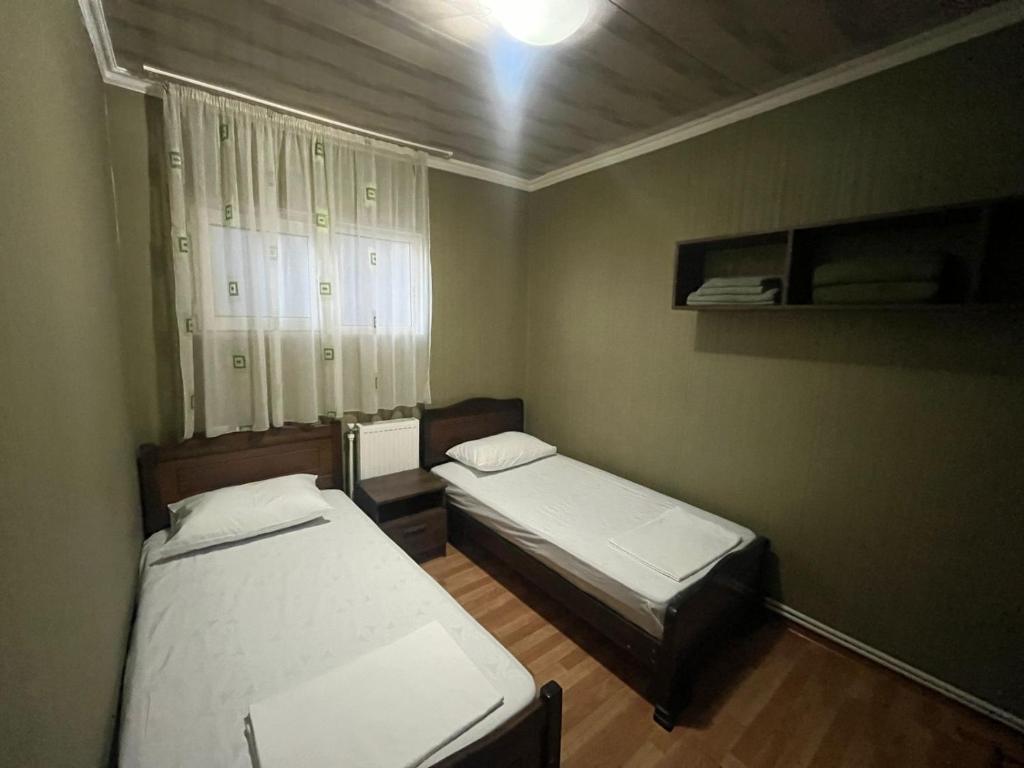 Postel nebo postele na pokoji v ubytování Nano Guest House