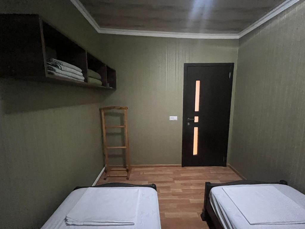 Postel nebo postele na pokoji v ubytování Nano Guest House