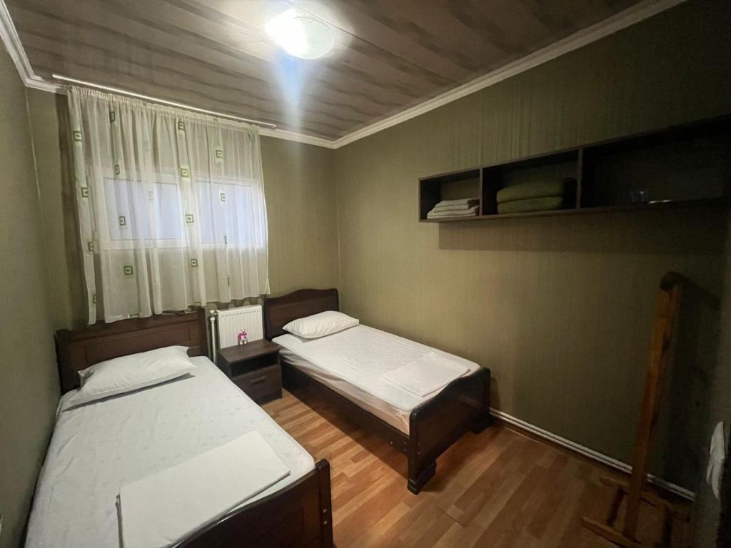 Postel nebo postele na pokoji v ubytování Nano Guest House