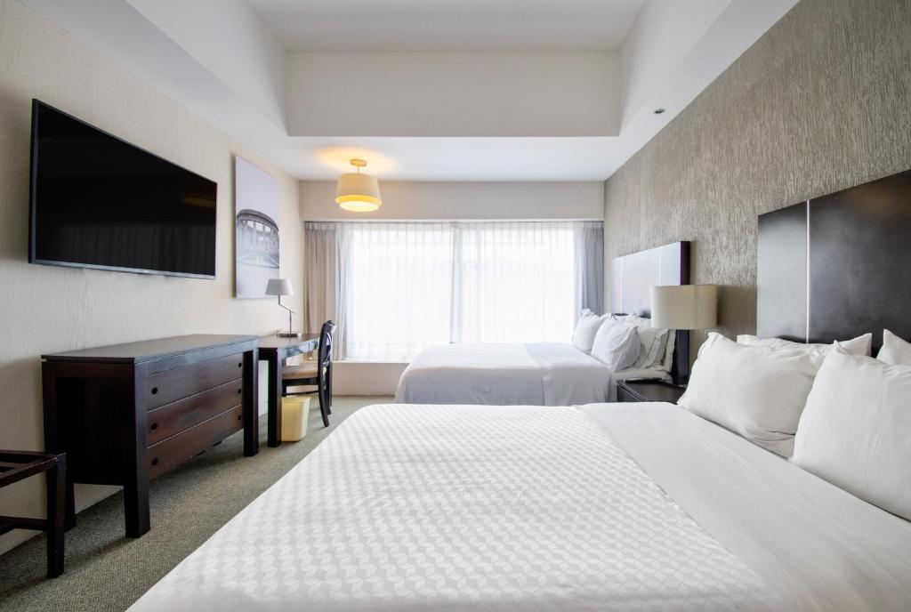 Postel nebo postele na pokoji v ubytování Hotel Plaza Génova Centro