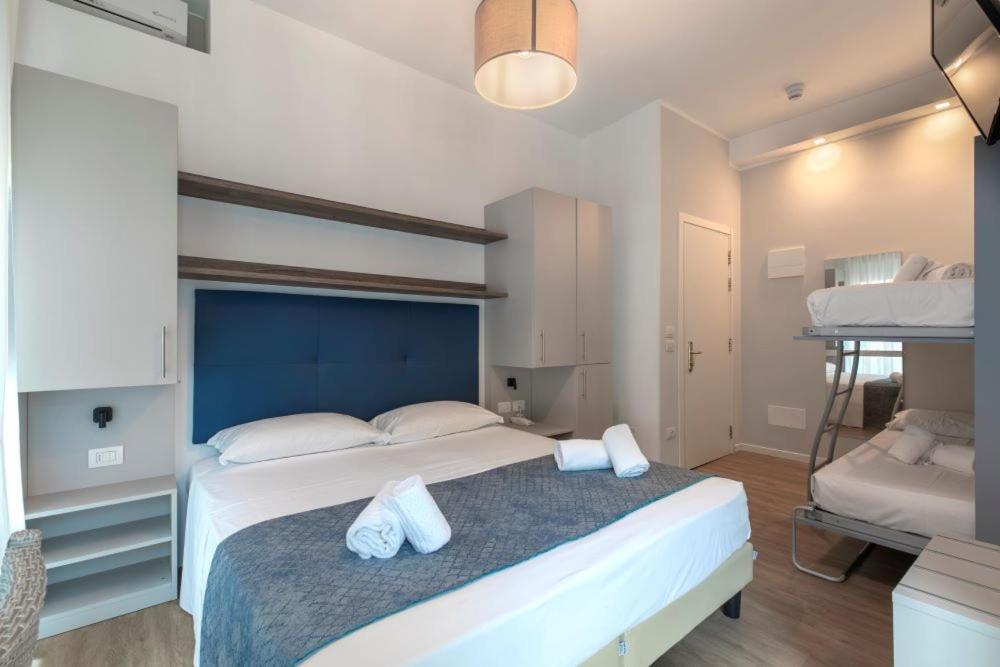 Postel nebo postele na pokoji v ubytování Hotel Danieli