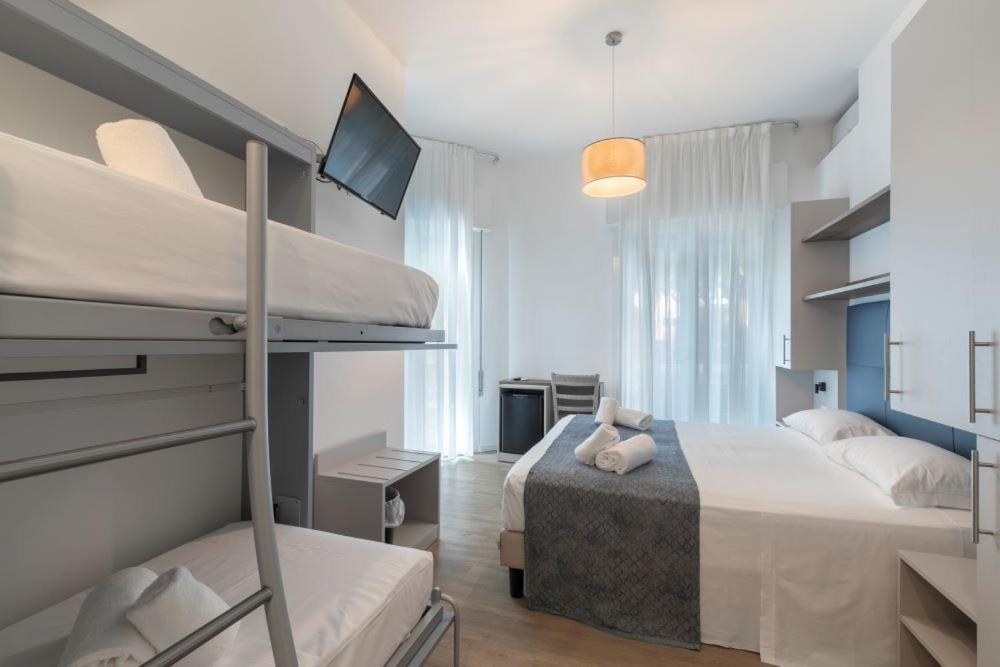 Postel nebo postele na pokoji v ubytování Hotel Danieli
