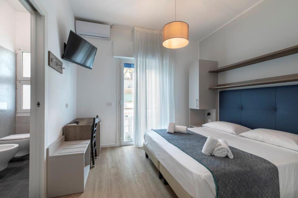 Postel nebo postele na pokoji v ubytování Hotel Danieli