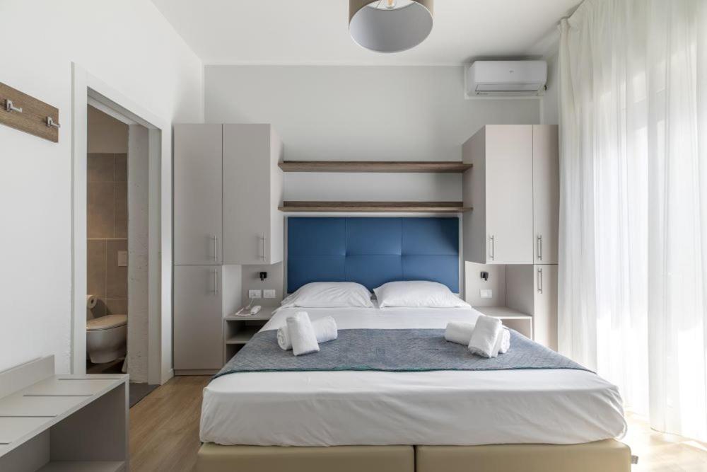 Postel nebo postele na pokoji v ubytování Hotel Danieli