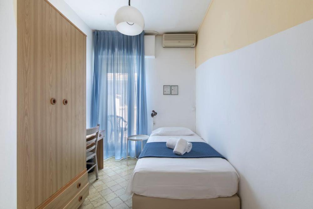 Postel nebo postele na pokoji v ubytování Hotel Danieli