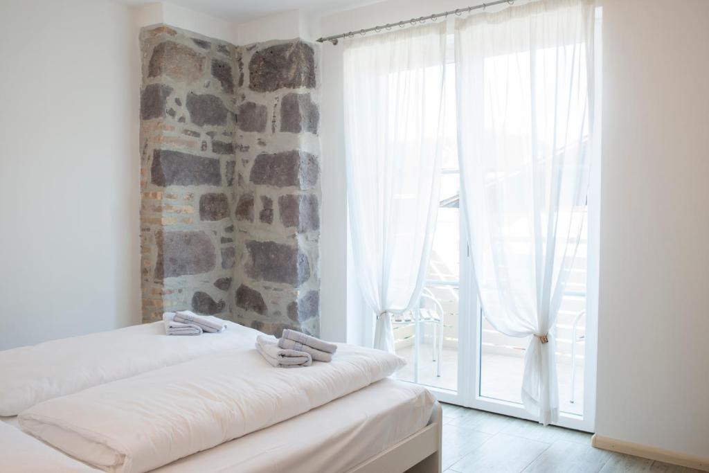 Postel nebo postele na pokoji v ubytování Apartment Residence Veronika