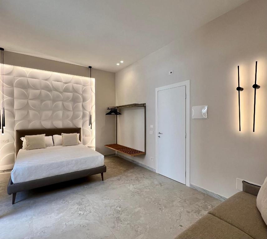 Ένα ή περισσότερα κρεβάτια σε δωμάτιο στο Elegant Rooms