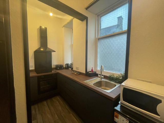 A cozinha ou kitchenette de Carlton Hotel