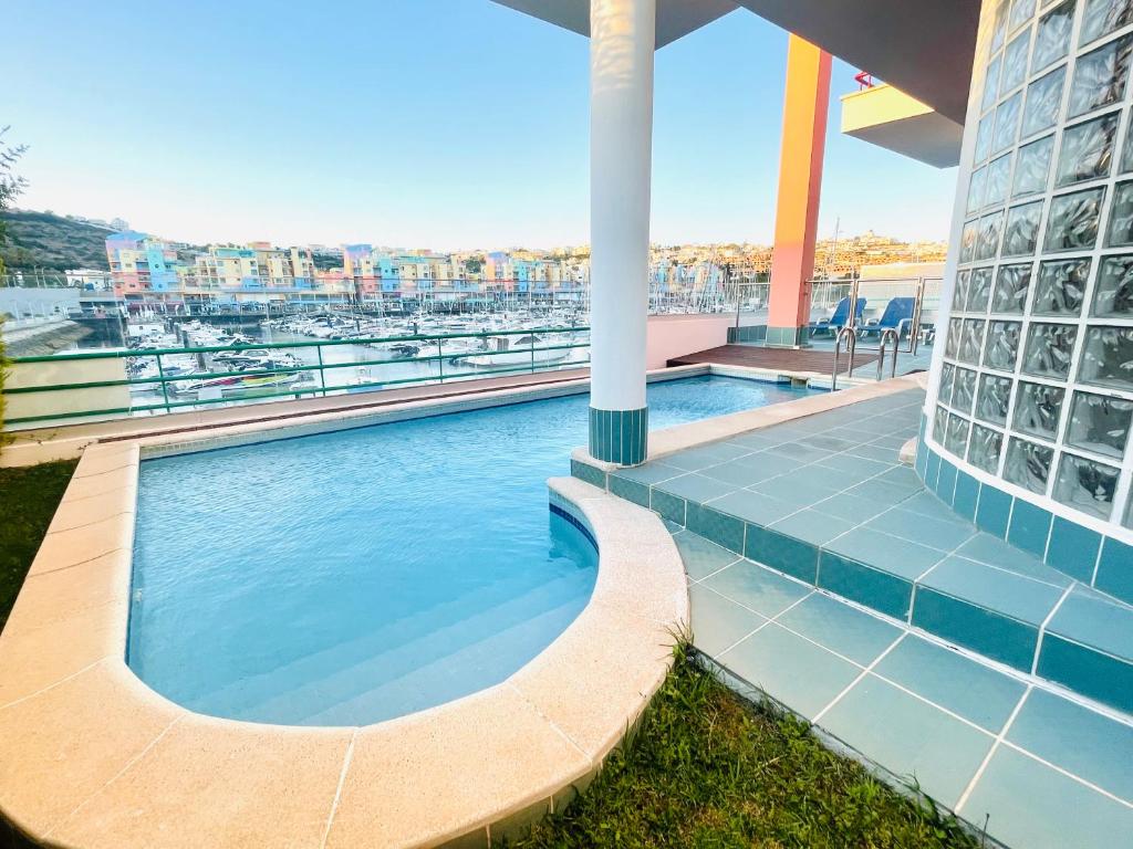 a swimming pool on the roof of a building at Vila D'Alba - Sem Stress in Albufeira