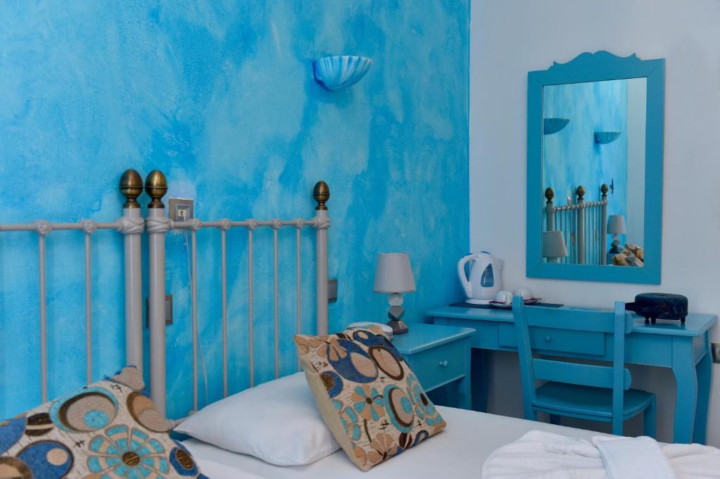 Postel nebo postele na pokoji v ubytování Aphrodite Boutique Hotel